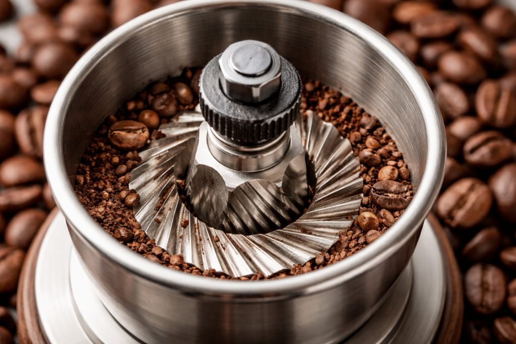 Best Manual Coffee Grinders (2026 Buyer’s Guide) 2 Close-up of stainless steel conical burrs in a manual coffee grinder