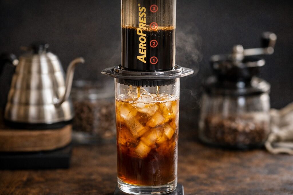 AeroPress iced coffee — flash brew method with hot water over ice — bright, aromatic, and ready in under 3 minutes